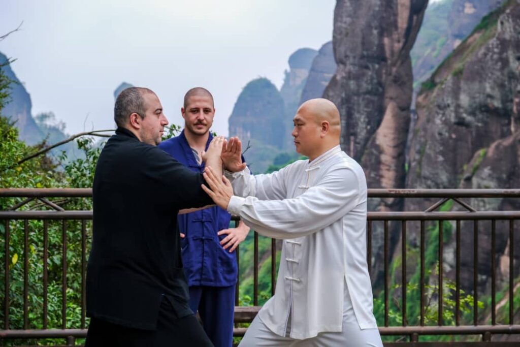 students practising tai chi with master shen