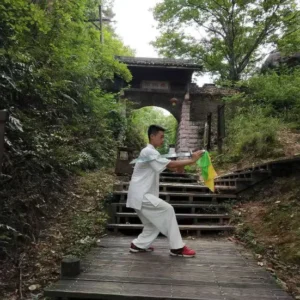 summer camp student learning tai chi sword