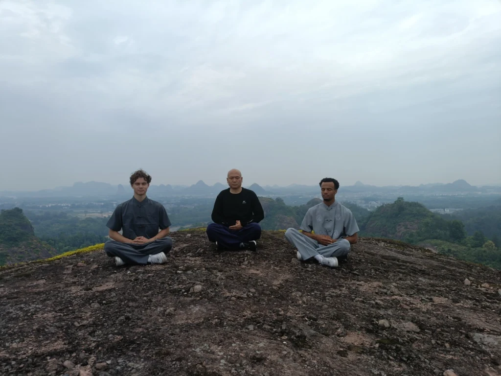 tai chi students meditate with master Shen Jiangfei
